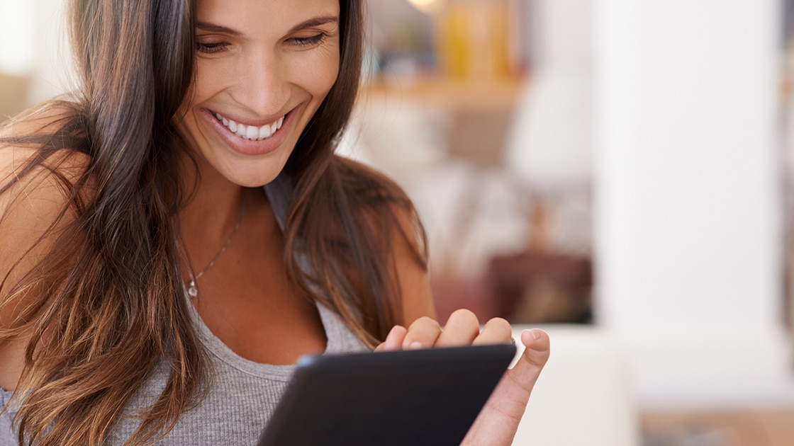 Smiling woman with cell phone
