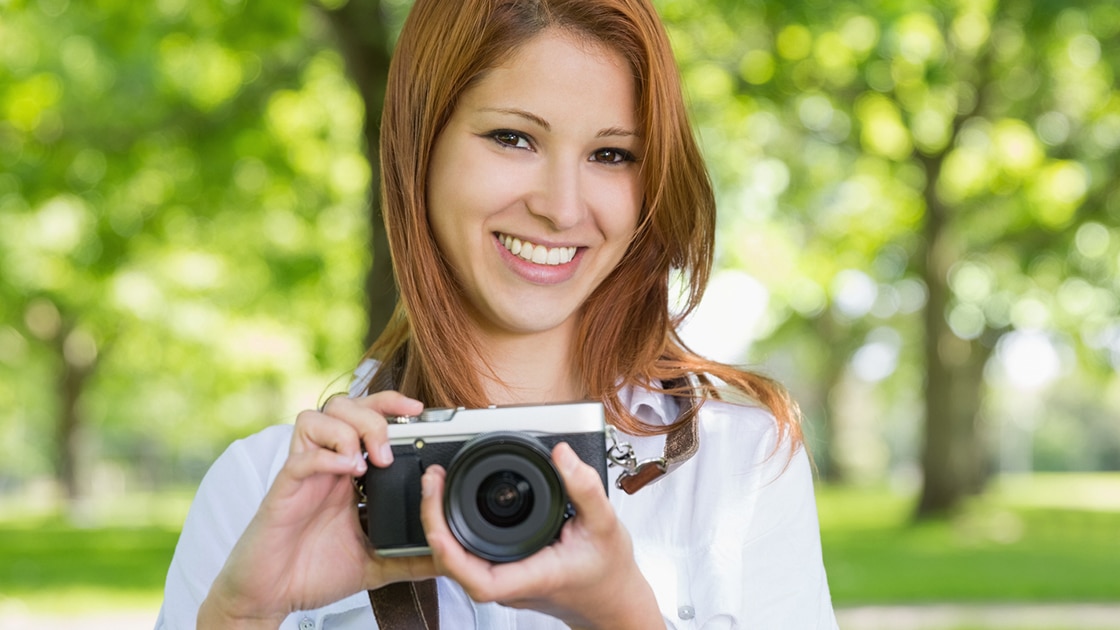 Smiling Woman with camera