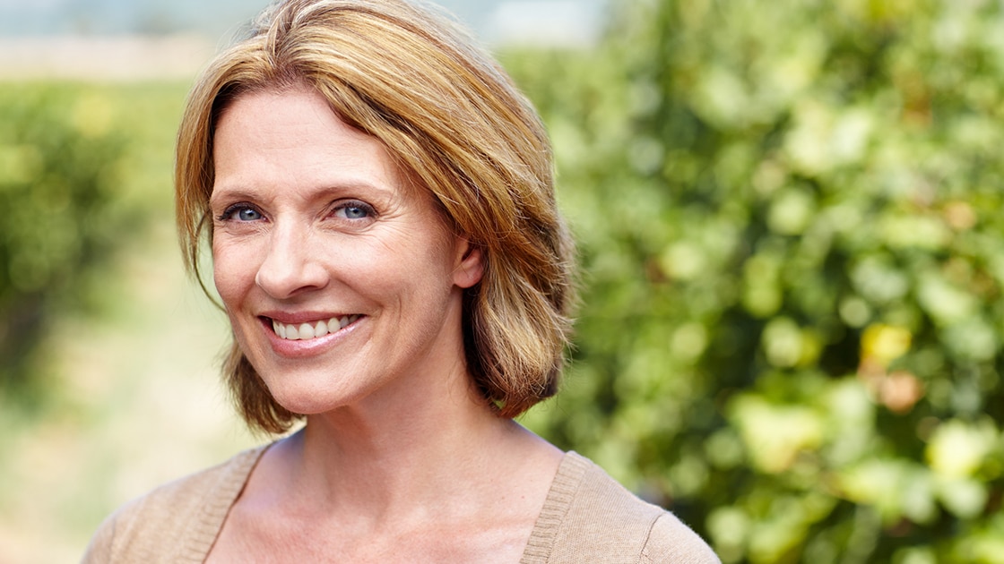 Smiling Woman at Vineyard